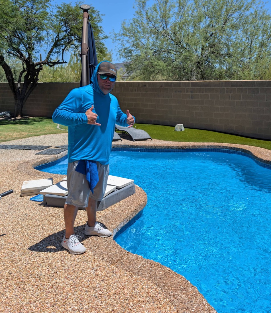 Steve McCool beside a pool on his route